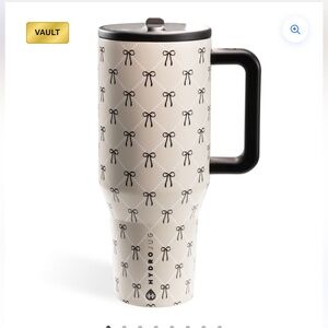 ** IN SEARCH OF **HydroJug Cream and Black Bow Design Mug